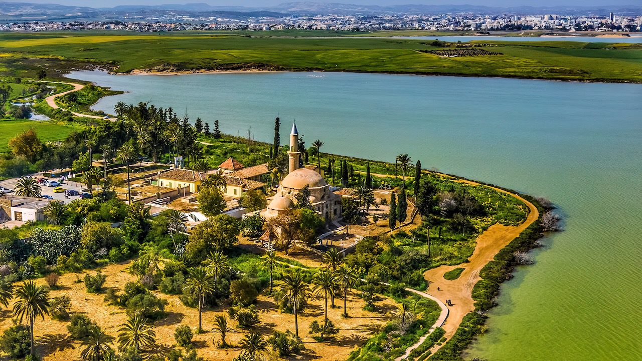Aerial view showcasing the serene Hala Sultan Tekke beside the Salt Lake in Larnaca, Cyprus.